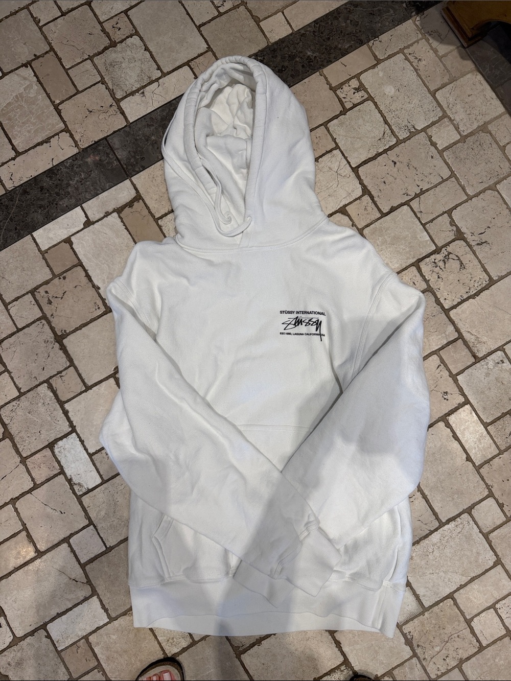 Stussy White Hoodie with Black logo and logo on back.